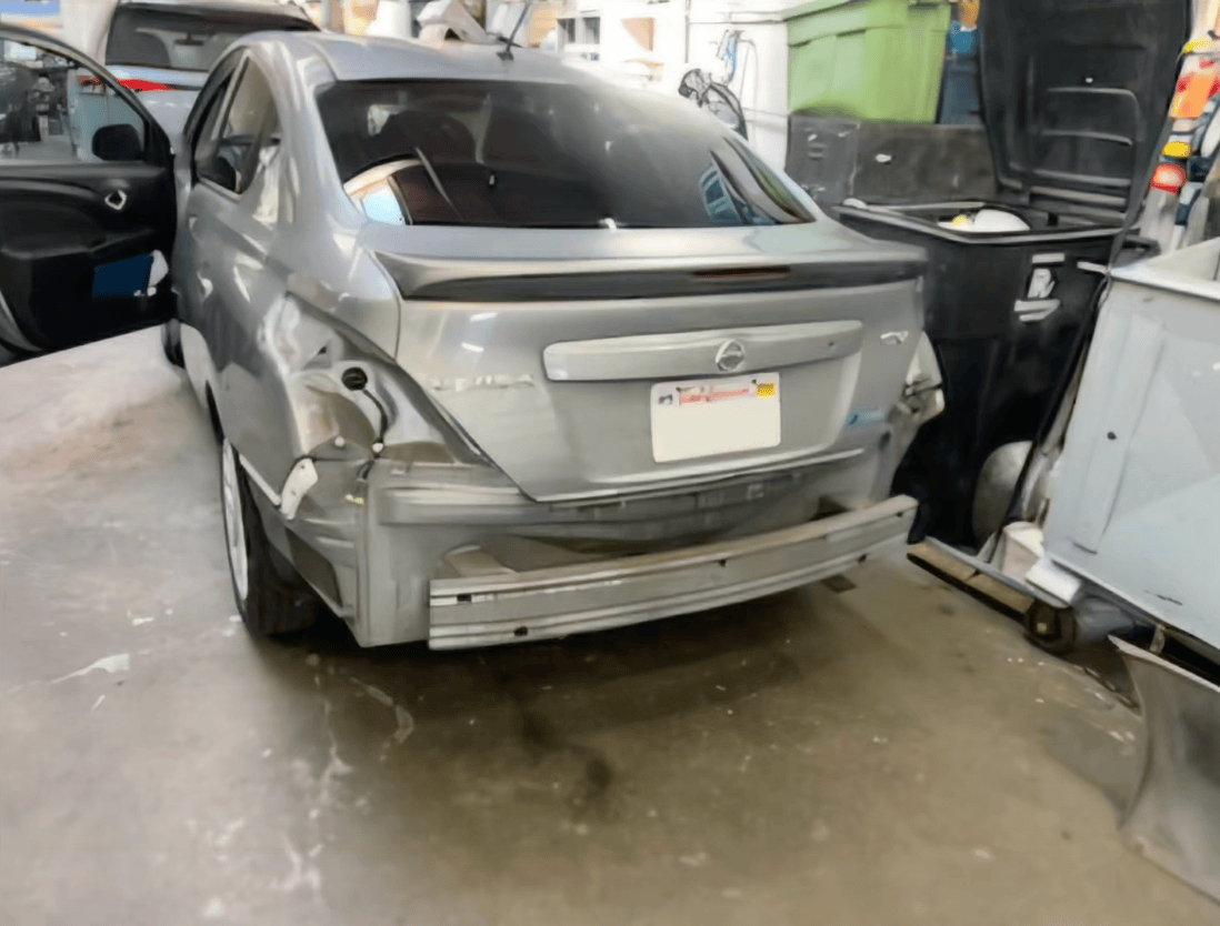 Nissan Versa before — rear-end damage